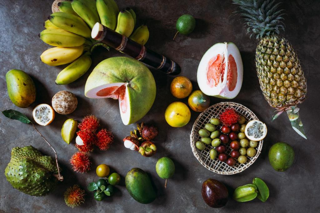 a bunch of fruits and vegetables on a table at Amal Beach Hotel in Bentota