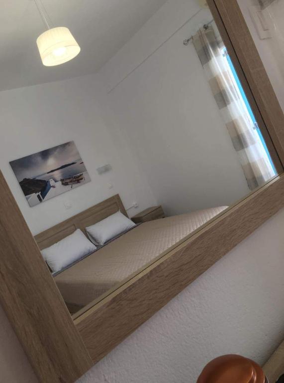 Postel nebo postele na pokoji v ubytování Firaxenia rooms