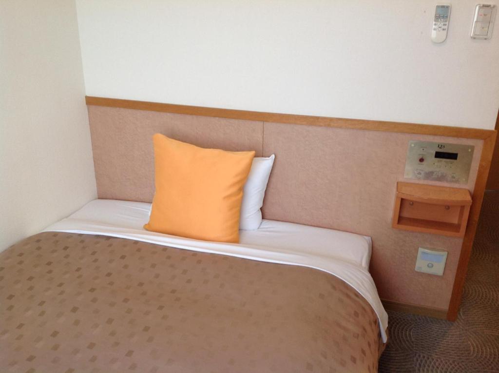 Voodi või voodid majutusasutuse Hotel 1-2-3 Shimada toas