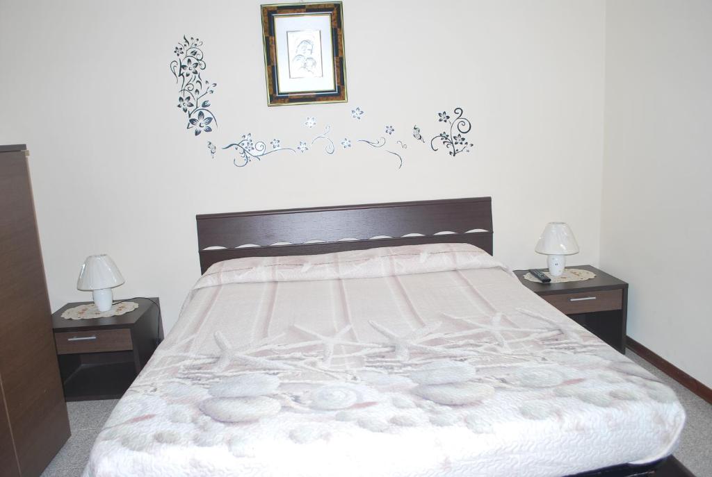 A bed or beds in a room at Stella Marina