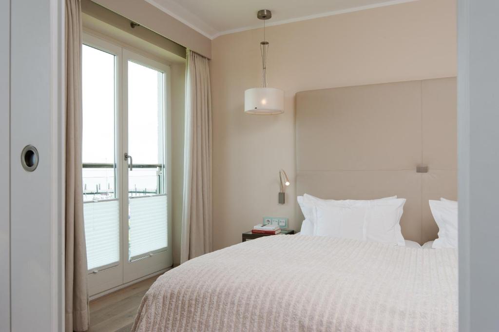 Postel nebo postele na pokoji v ubytování Hotel Fährhaus