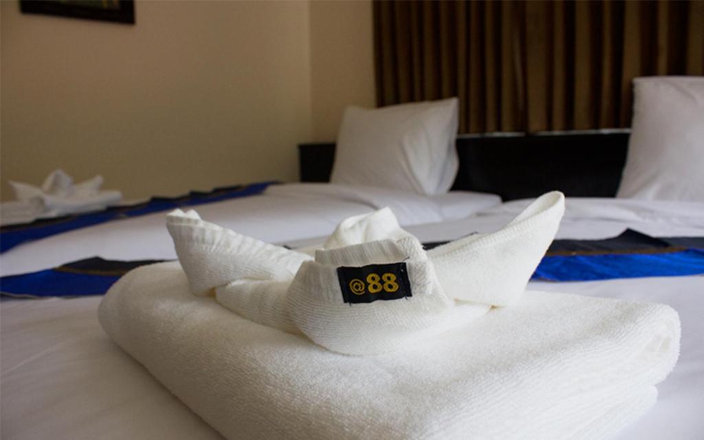 Postel nebo postele na pokoji v ubytování 88 Hotel