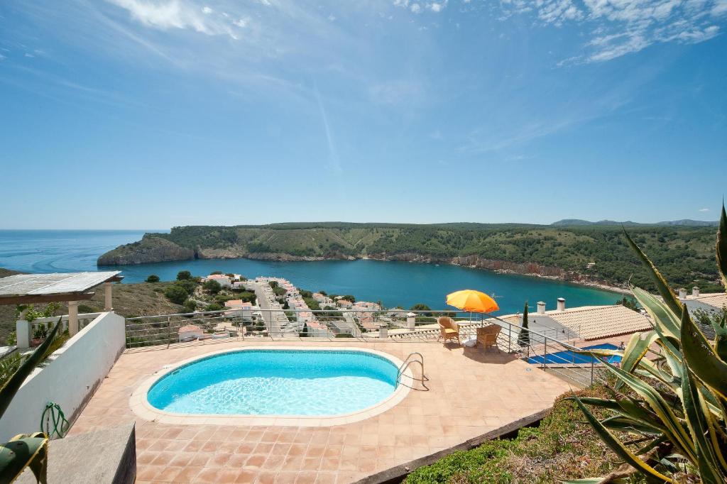 a swimming pool with a view of a lake at Montgo 1 in L'Escala