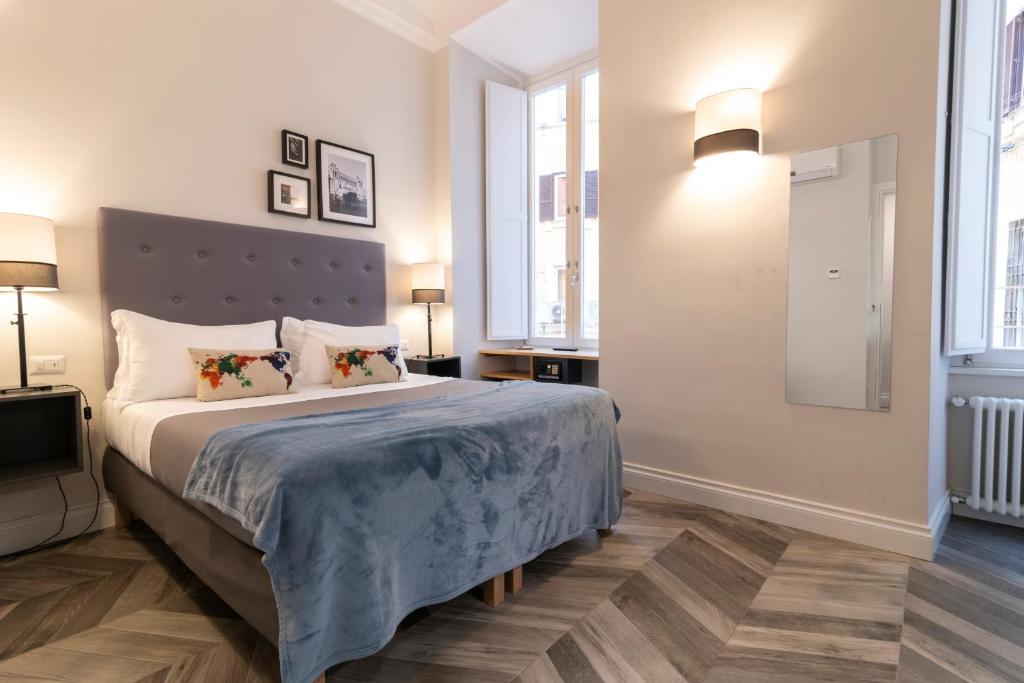 Posteľ alebo postele v izbe v ubytovaní Eccelso Hotel