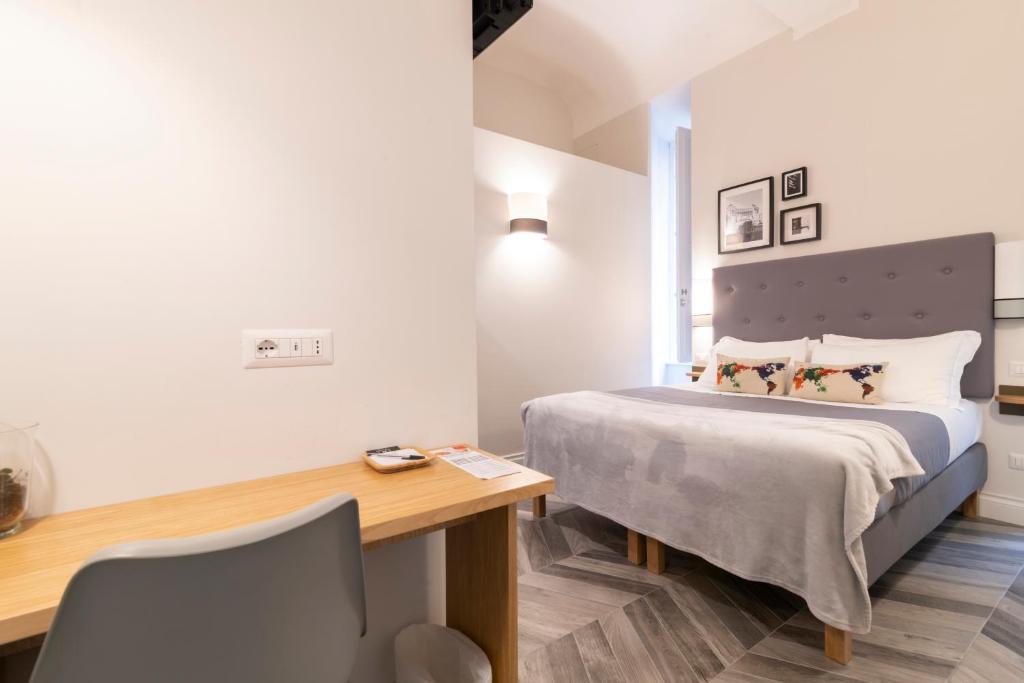 Posteľ alebo postele v izbe v ubytovaní Eccelso Hotel