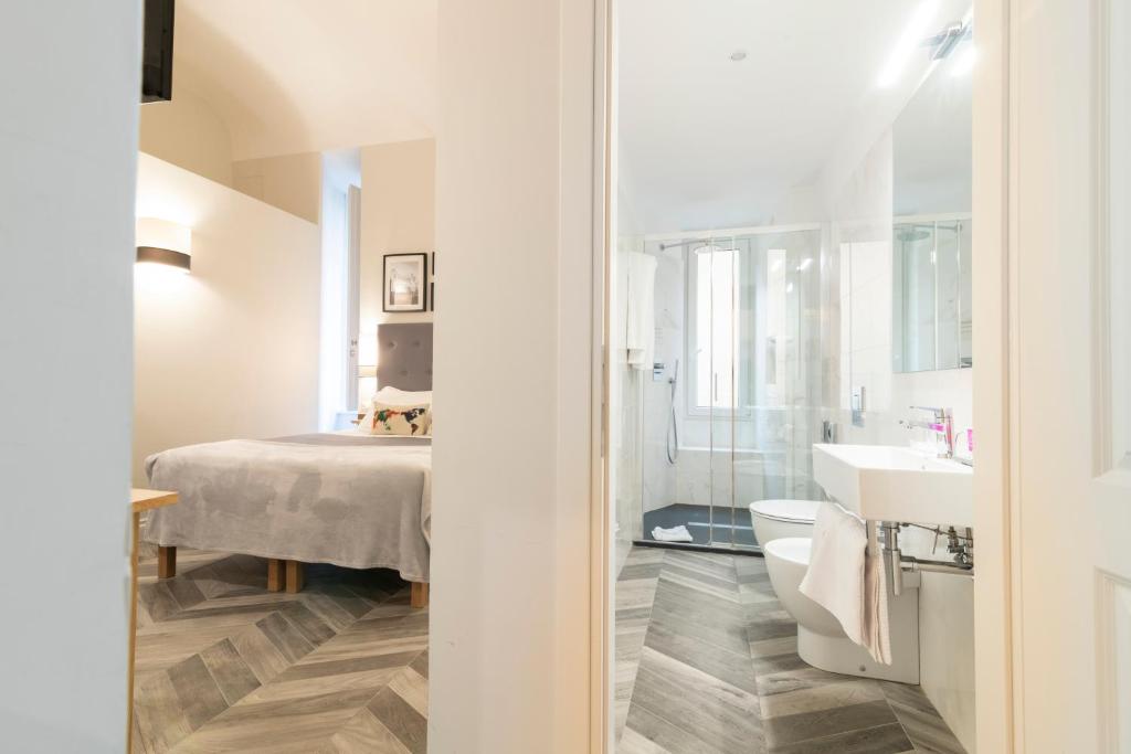 Posteľ alebo postele v izbe v ubytovaní Eccelso Hotel