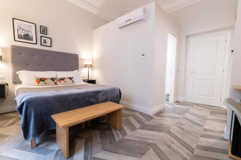 Posteľ alebo postele v izbe v ubytovaní Eccelso Hotel