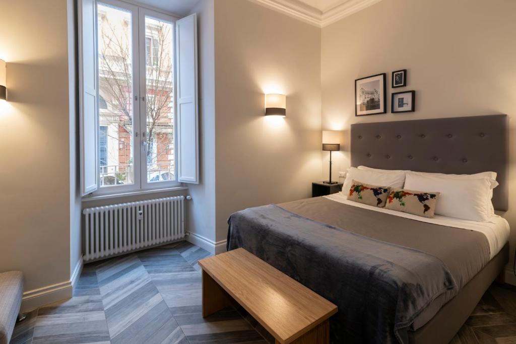 Posteľ alebo postele v izbe v ubytovaní Eccelso Hotel