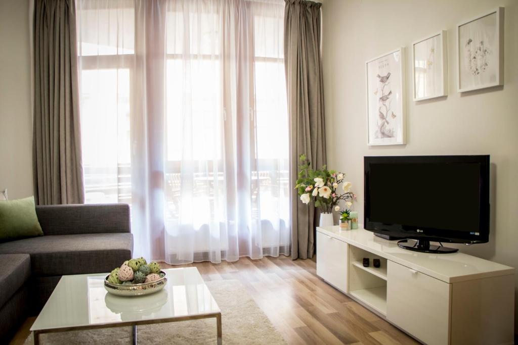 Televízia a/alebo spoločenská miestnosť v ubytovaní Don Quijote Apartment