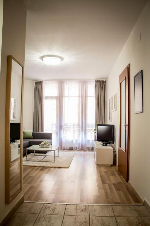 Televízia a/alebo spoločenská miestnosť v ubytovaní Don Quijote Apartment