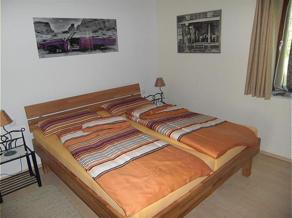 Postel nebo postele na pokoji v ubytování Ferienwohnung am Rosengarten