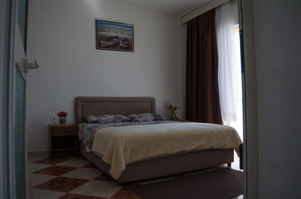 Postel nebo postele na pokoji v ubytování Apartments Basha 1 - Long Beach