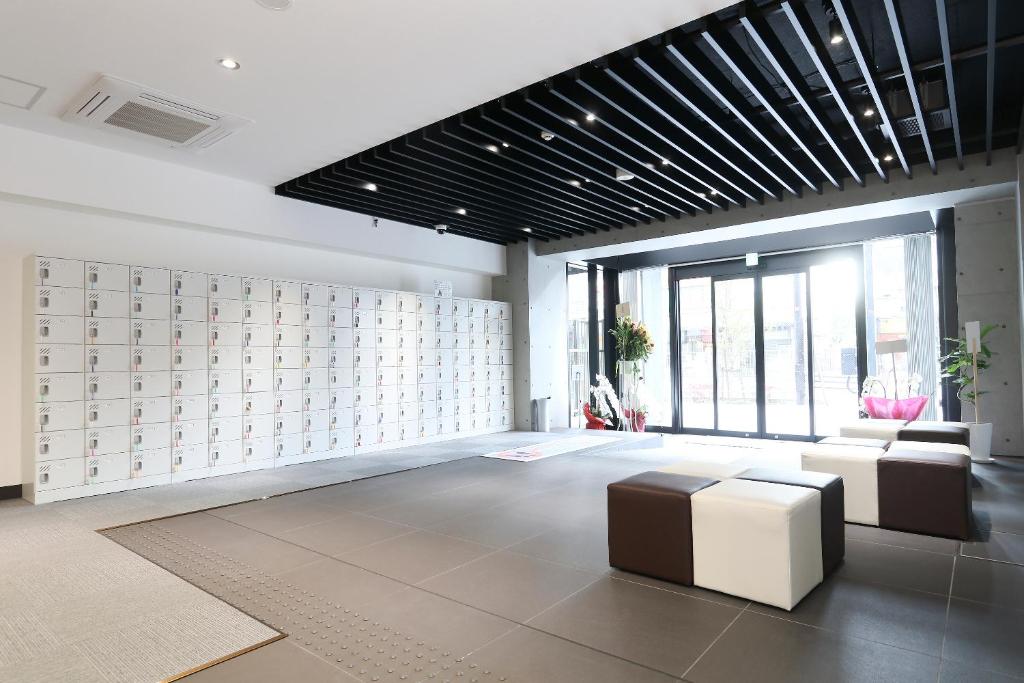 Posezení v ubytování Business Capsule Hotel Lightning Hotel Asakusa