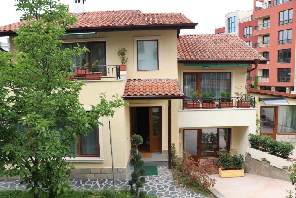 a house with a red tile roof at Urban House in Sofia