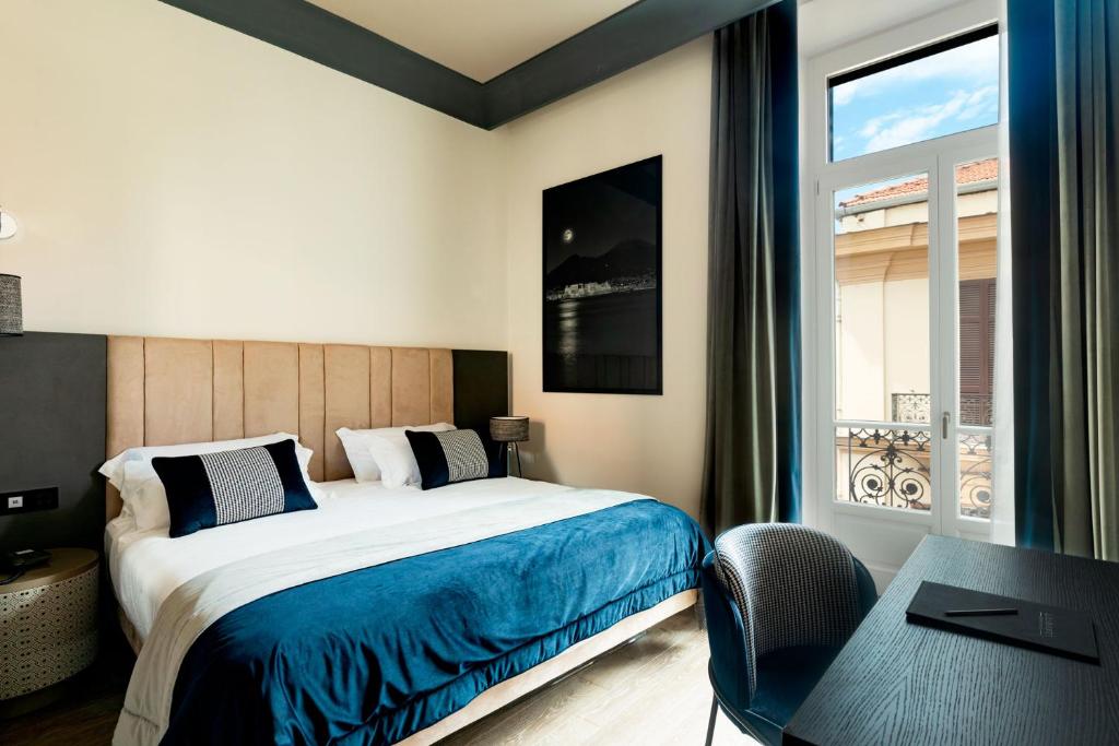 Postel nebo postele na pokoji v ubytování Amadomus Luxury Suites