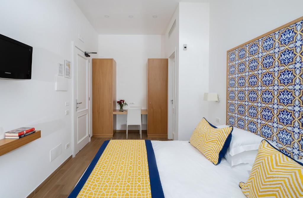 Postel nebo postele na pokoji v ubytování Hotel Miramare