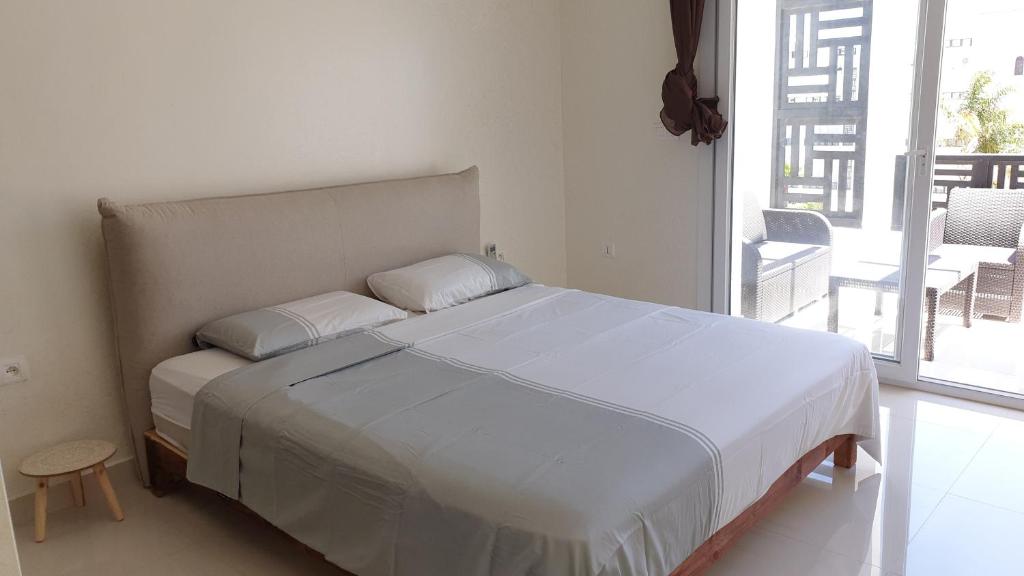 Postel nebo postele na pokoji v ubytování Riad Saidia