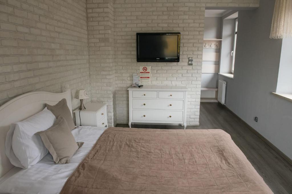 Posteľ alebo postele v izbe v ubytovaní Apartamenty Faust