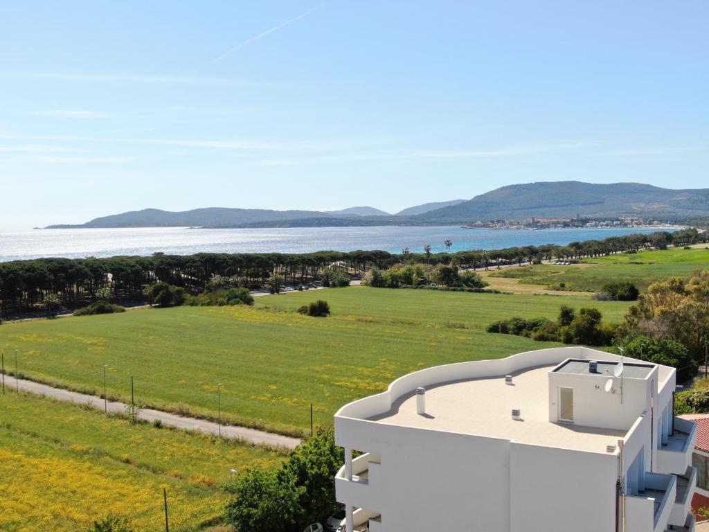 a view of the ocean from a house at Milena Suite Apartments in Alghero