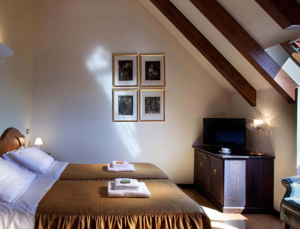 Postel nebo postele na pokoji v ubytování Hotel Villa Giulia