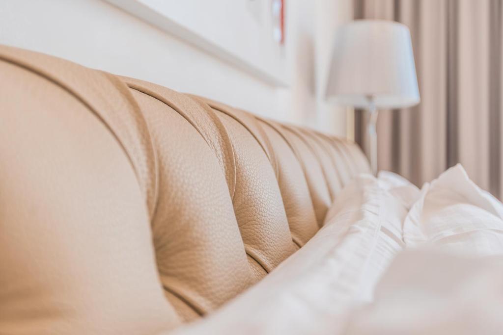 a close up of a persons feet on a bed at Palazzo Violetta in Sliema