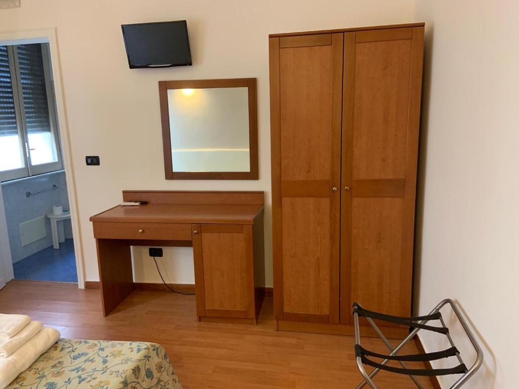 Postel nebo postele na pokoji v ubytování Hotel Lungomare
