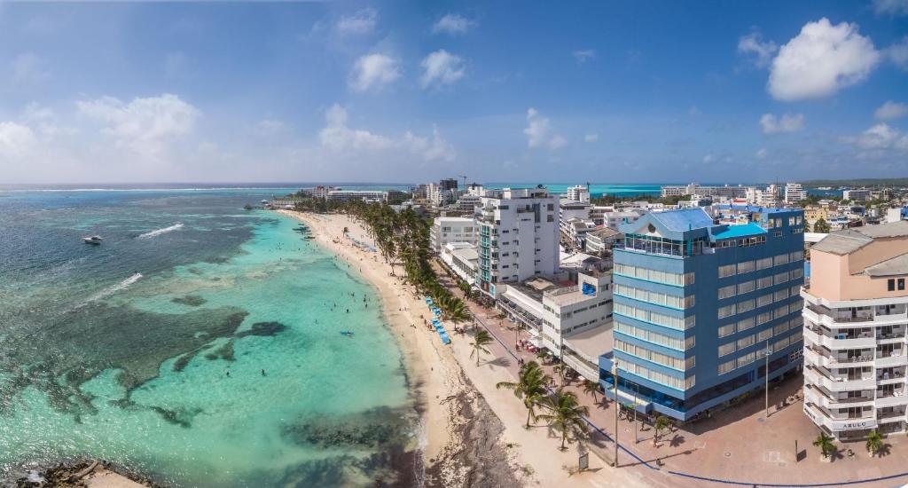 an aerial view of a beach and the ocean at Calypso Beach Hotel in San Andrés