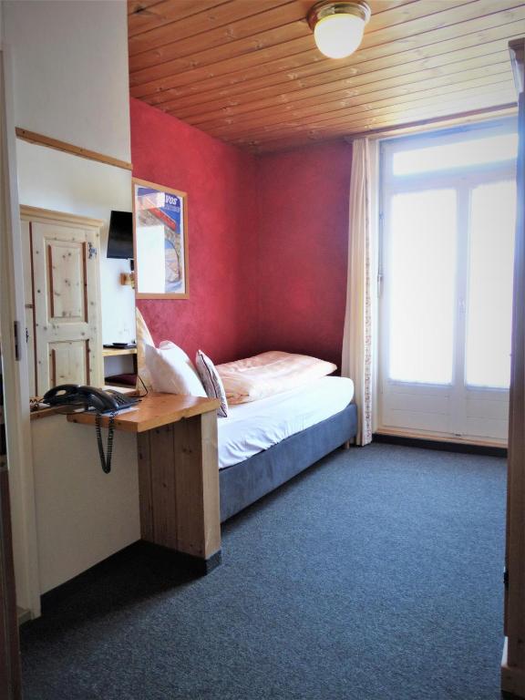 Postel nebo postele na pokoji v ubytování Hotel Bündnerhof