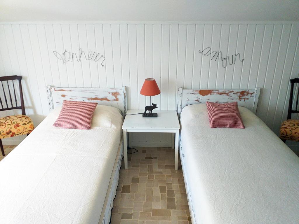 Letto o letti in una camera di B&B dei Laghi
