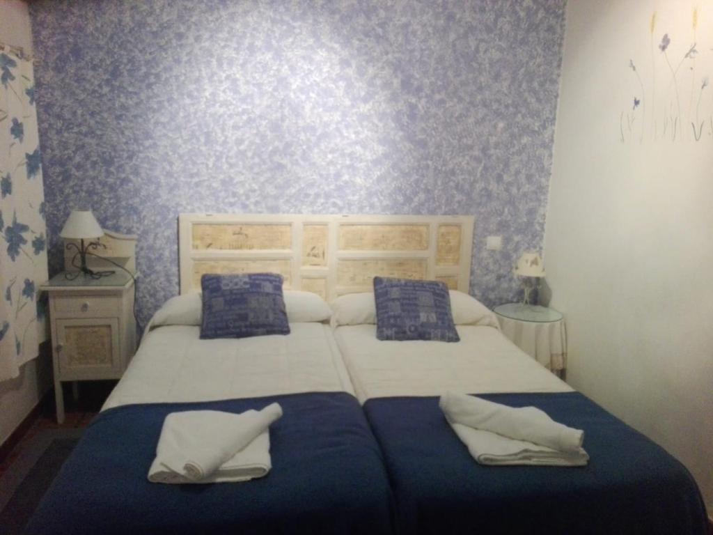 Postel nebo postele na pokoji v ubytování Casa rural El Rincón