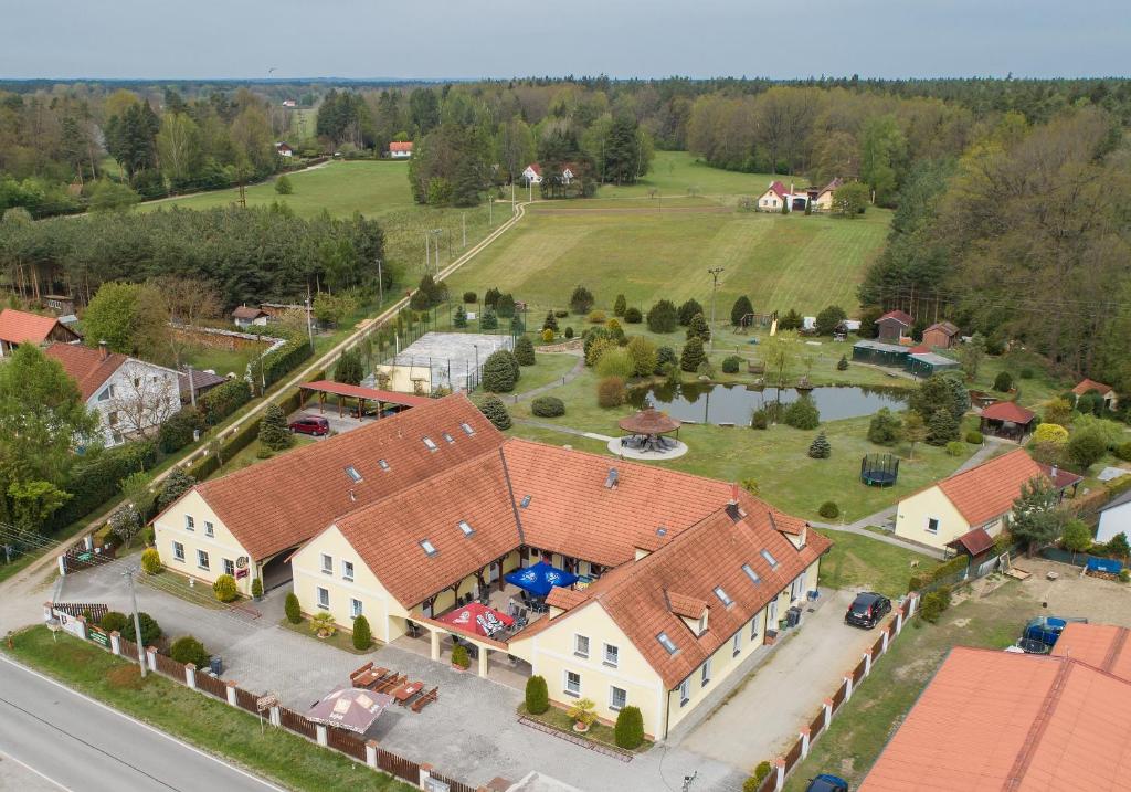 an aerial view of a large house with a yard at Penzion Kosky in Hamr