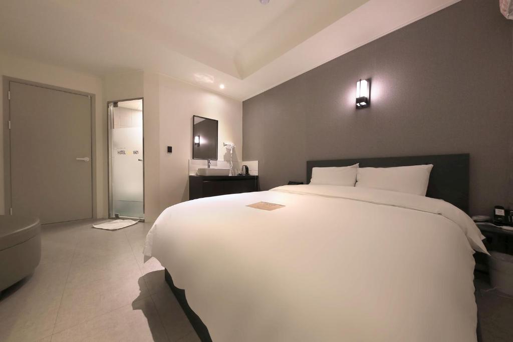 Postel nebo postele na pokoji v ubytování Hotel Yam