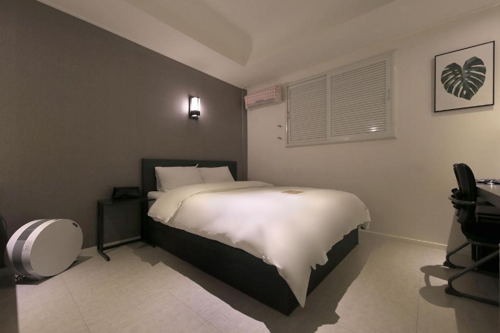 Postel nebo postele na pokoji v ubytování Hotel Yam