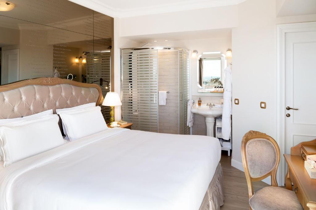 Posteľ alebo postele v izbe v ubytovaní Legacy Gastro Suites