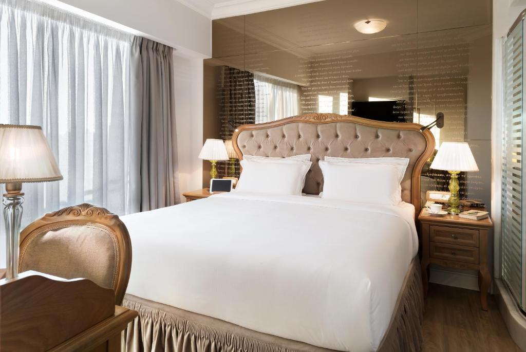 Posteľ alebo postele v izbe v ubytovaní Legacy Gastro Suites