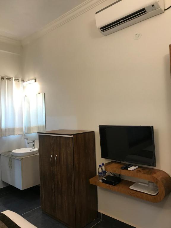 TV a/nebo společenská místnost v ubytování Rankk Stays
