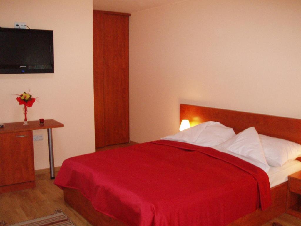 Postel nebo postele na pokoji v ubytování Hotel Jezero
