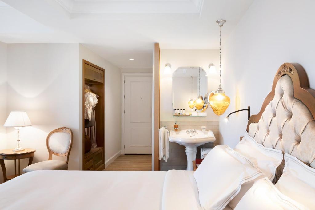 Posteľ alebo postele v izbe v ubytovaní Legacy Gastro Suites