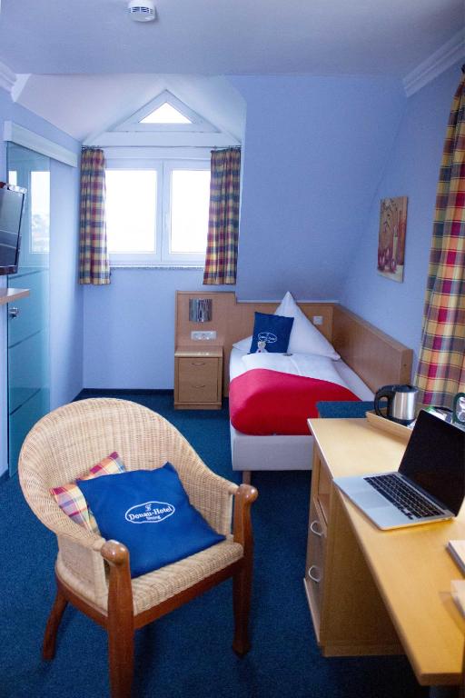 Postel nebo postele na pokoji v ubytování Donau-Hotel