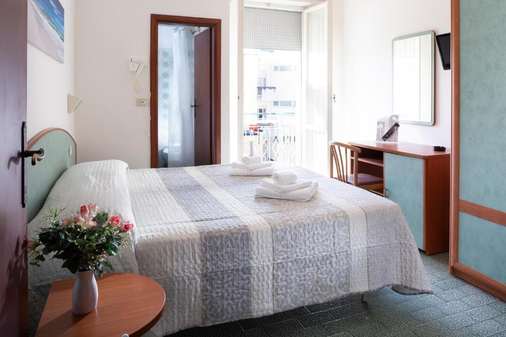 Postel nebo postele na pokoji v ubytování Hotel Mara