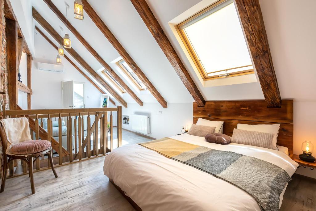 a bedroom with a large bed in a attic at Casa Carolina Brasov in Braşov