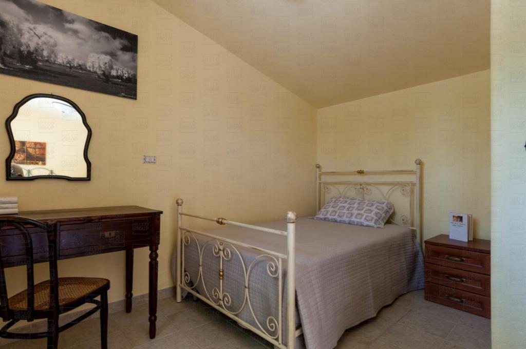 Łóżko lub łóżka w pokoju w obiekcie HelloApulia - Villa Flora