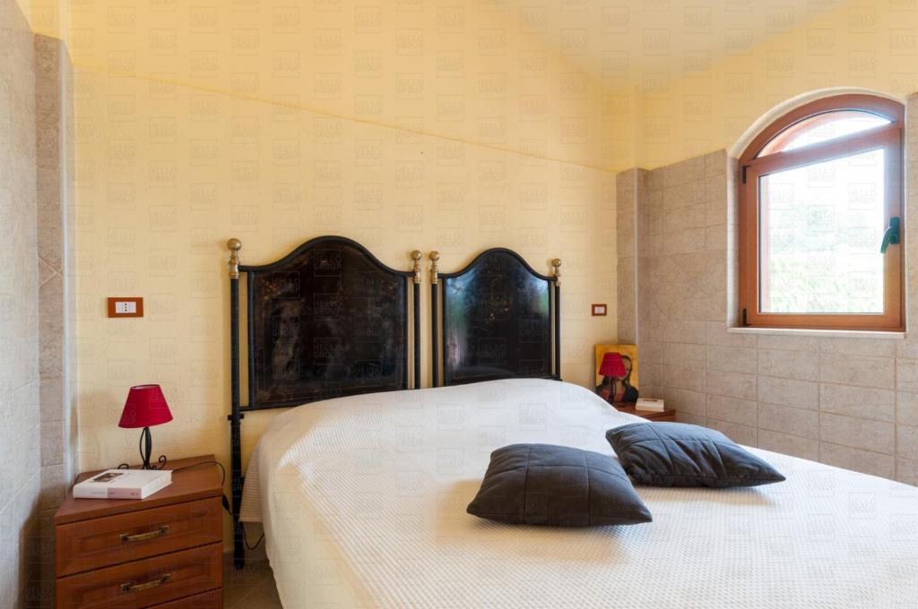Łóżko lub łóżka w pokoju w obiekcie HelloApulia - Villa Flora