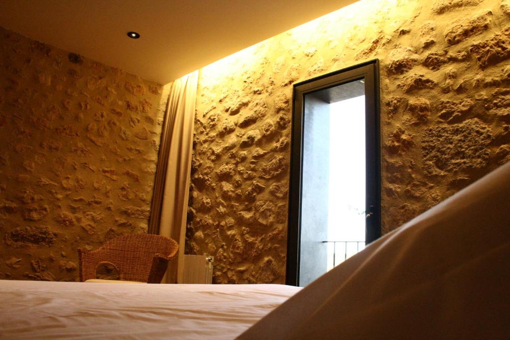 Postel nebo postele na pokoji v ubytování Hotel Mas Oliveres Pla de Palau