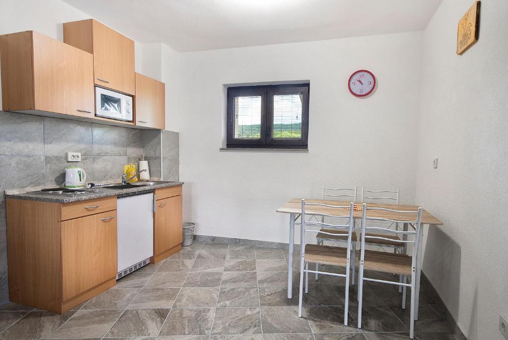 Kuchyň nebo kuchyňský kout v ubytování Apartments Matko