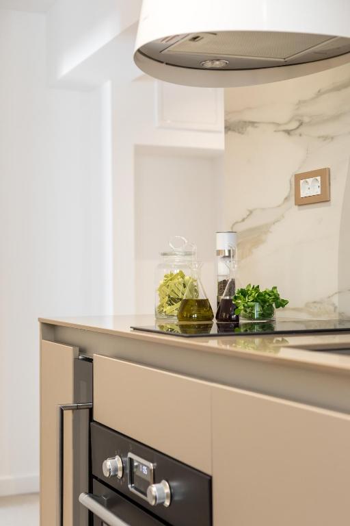 a kitchen with a counter with a counter top at Park Residence in Split