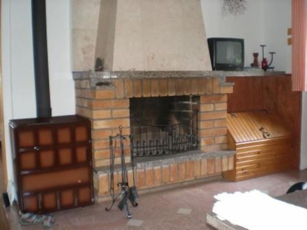 TV a/nebo společenská místnost v ubytování Chata Lešov
