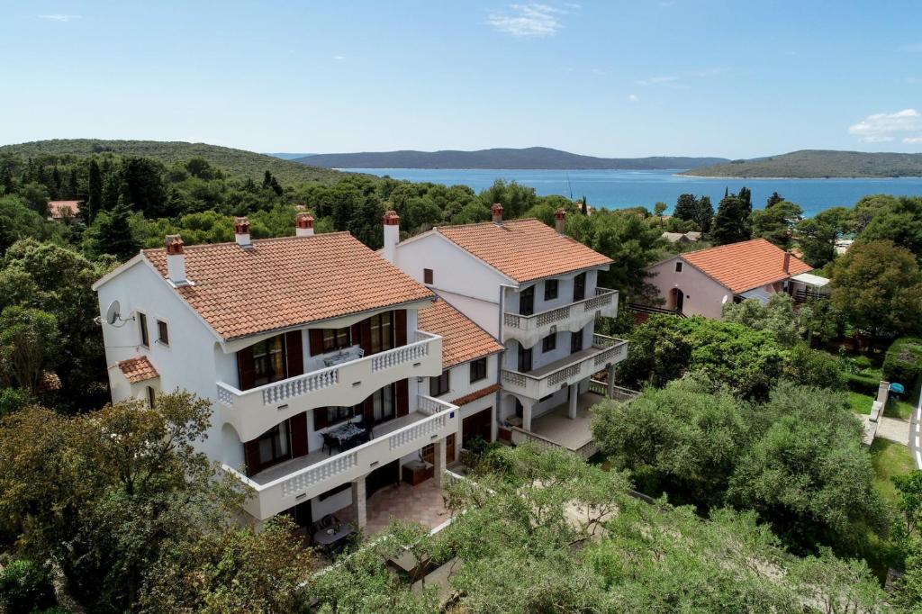 an aerial view of a house with a view of the water at Apartments Mrva in Ugljan