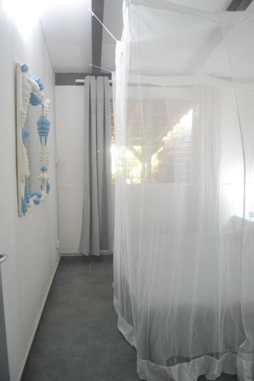 Postel nebo postele na pokoji v ubytování an eol caraibes