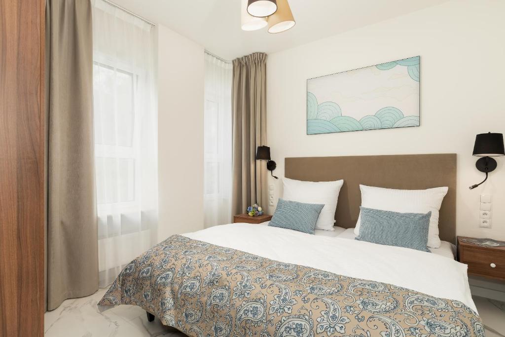 Ein Bett oder Betten in einem Zimmer der Unterkunft Aquamarina Onyx Marina Invest